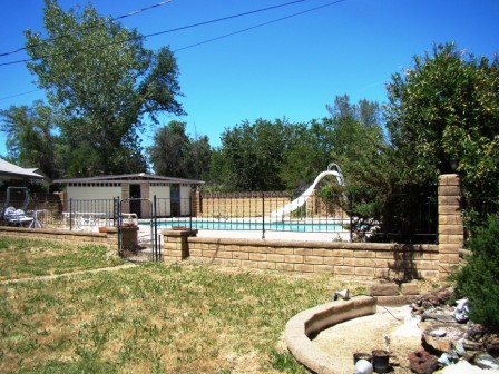 12221 Sandstone Drive Redding, CA 96003 - Photo 14 of 33 a view of a swimming pool with a patio
