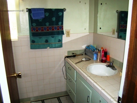 12221 Sandstone Drive Redding, CA 96003 - Photo 29 of 33 a bathroom with a sink and a mirror