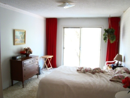 12221 Sandstone Drive Redding, CA 96003 - Photo 30 of 33 a bedroom with a bed and a window