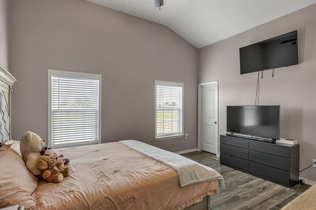 9500 Old Nacogdoches Trail Forney, TX 75126 - Photo 22 of 40 a bedroom with a bed and a flat screen tv