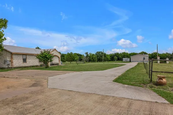 a view of a house with a big yard
