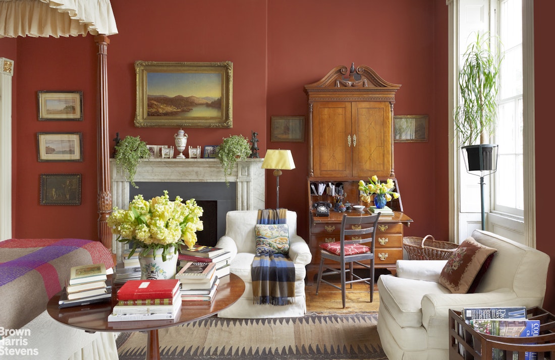203 Prince Street Manhattan, NY 10012 - Photo 13 of 45 a living room with furniture a fireplace and a potted plant