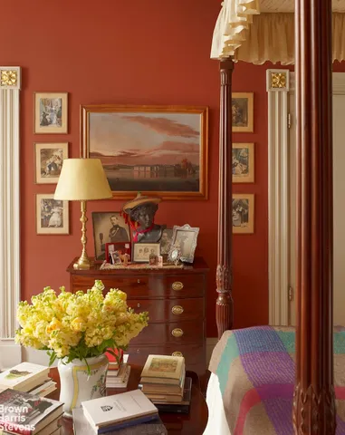 a living room with furniture and a lamp