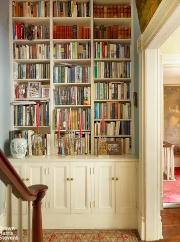 a bed room with a bed furniture and a fireplace