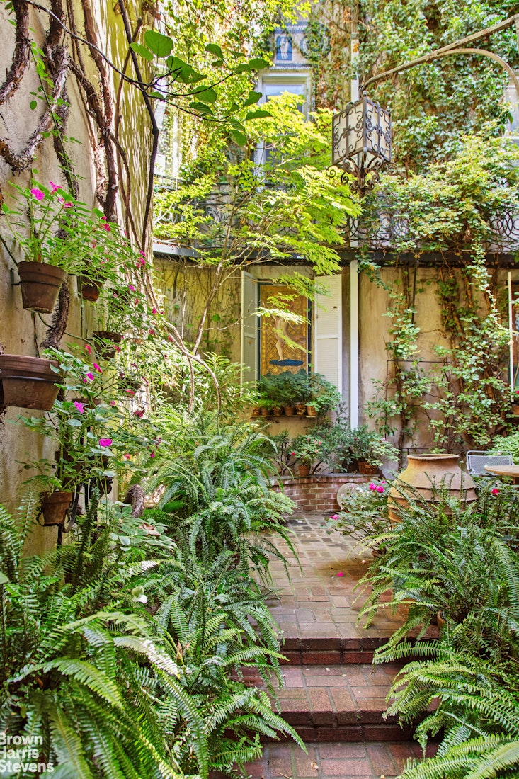 203 Prince Street Manhattan, NY 10012 - Photo 20 of 45 a front view of a house with a yard