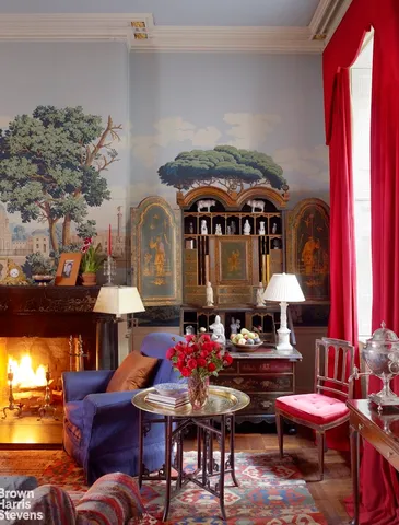 a living room with furniture and potted plant