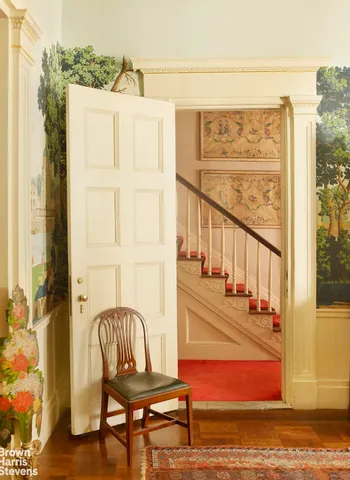 a living room with furniture a fireplace and a window