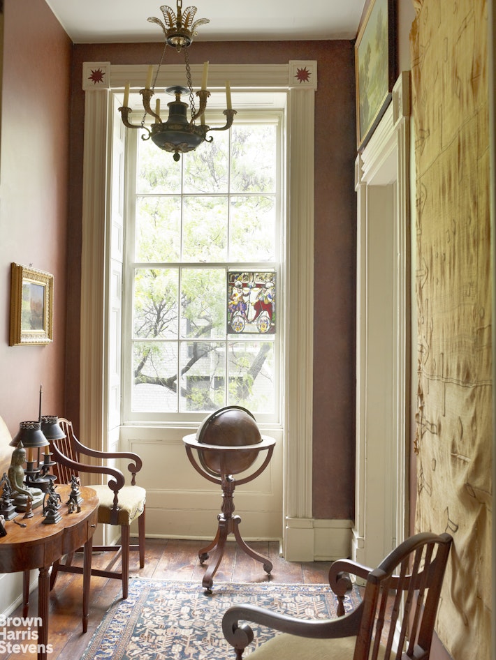 203 Prince Street Manhattan, NY 10012 - Photo 32 of 45 a living room with furniture and a window