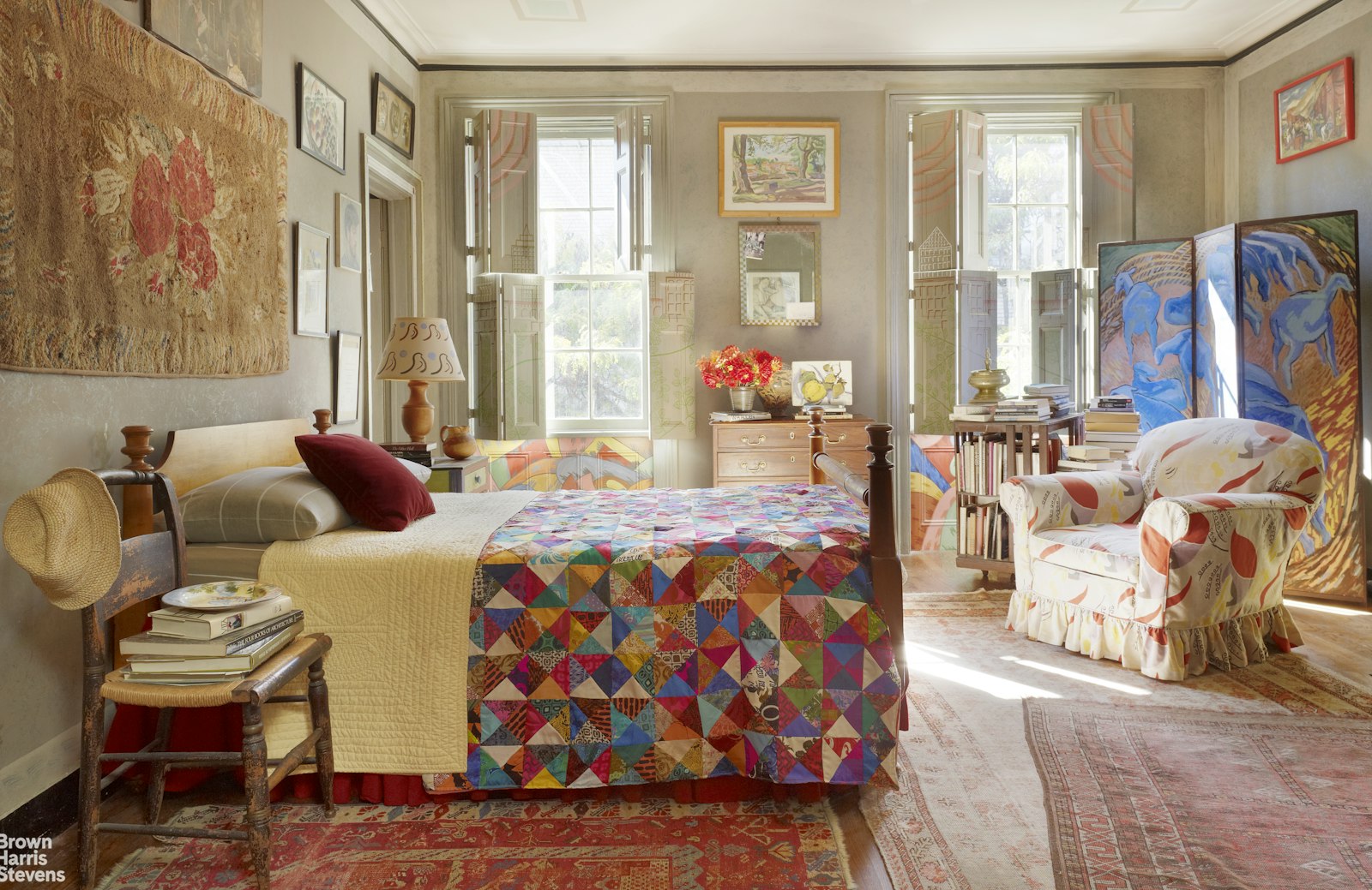 203 Prince Street Manhattan, NY 10012 - Photo 37 of 45 a bedroom with furniture and a large window