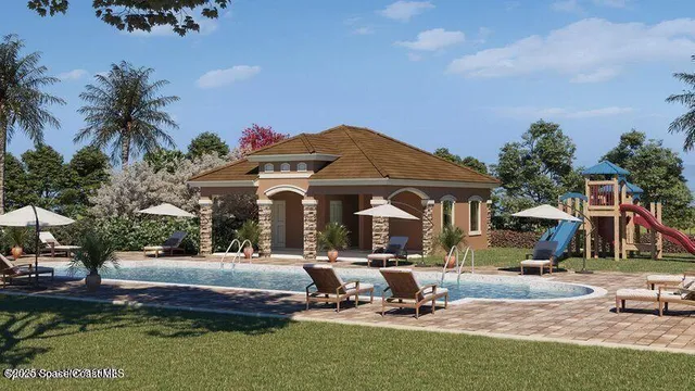 a front view of a building with garden and trees