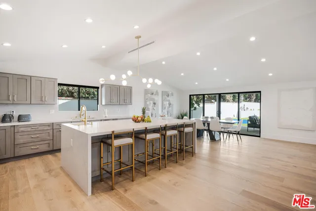 a kitchen with lots of counter top space and living room