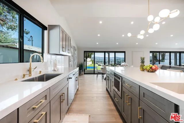 a kitchen with kitchen island granite countertop lots of counter top space