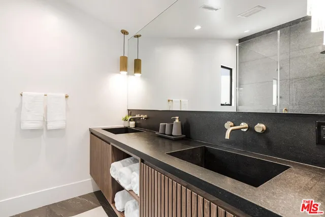 a kitchen with a sink cabinets and window