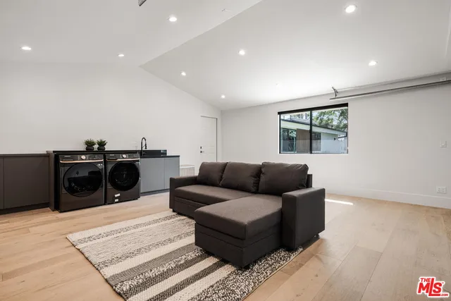 a living room with furniture and a rug