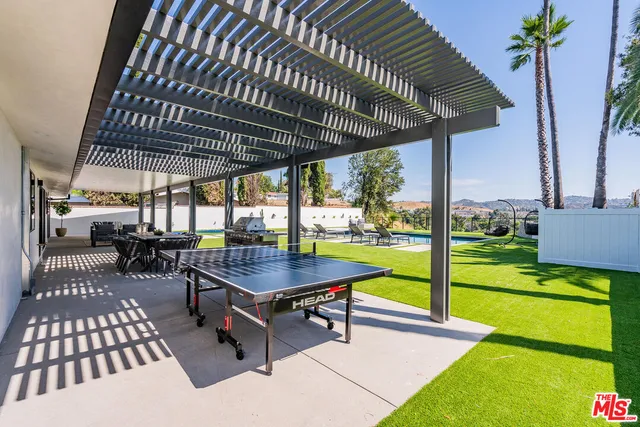 a view of a swimming pool with a patio