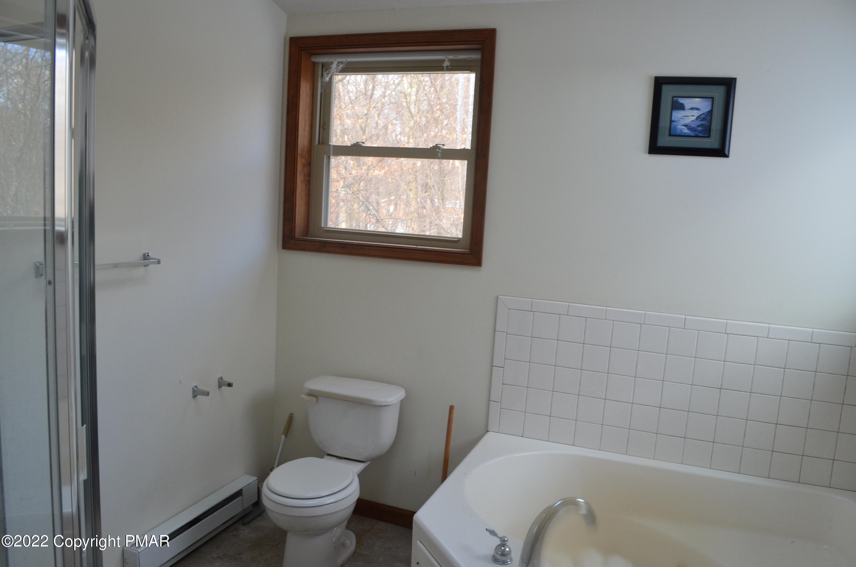 145 Pontiac Path Pocono Lake, PA 18347 - Photo 11 of 13 a bathroom with a toilet and a bath tub