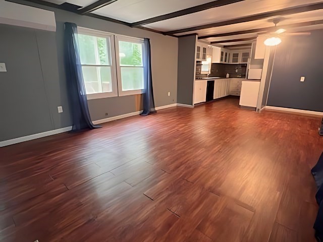 217 Cheshire Park Wareham, MA 02571 - Photo 2 of 13 a view of empty room with wooden floor and kitchen view