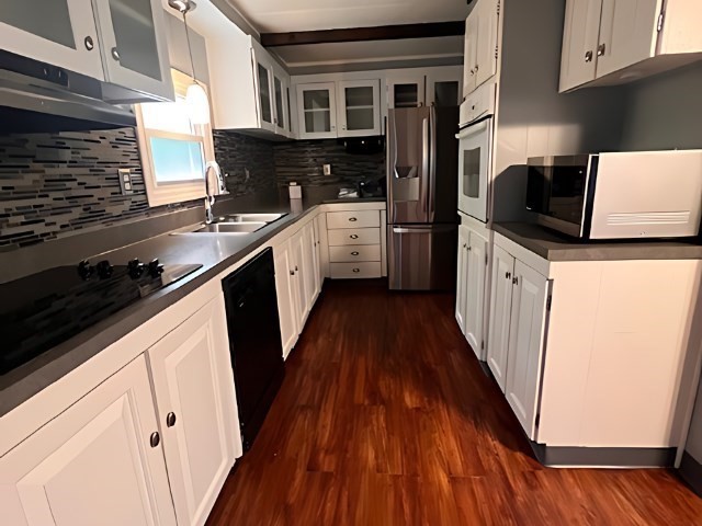 217 Cheshire Park Wareham, MA 02571 - Photo 4 of 13 a kitchen with a sink a refrigerator and cabinets