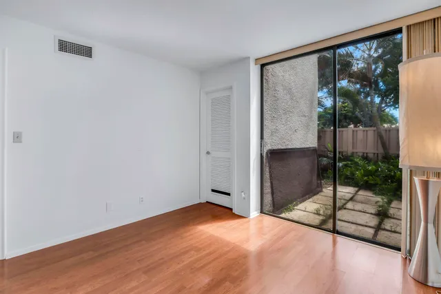 a lobby with furniture and potted plants