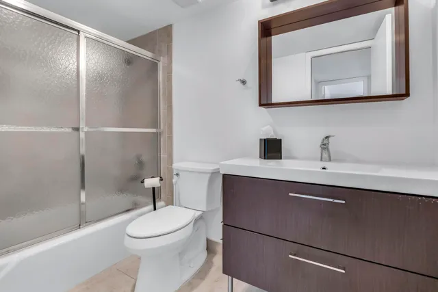 a view of an empty room with a large window