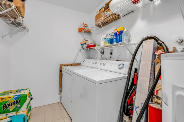 a view of a house with a small yard and plants