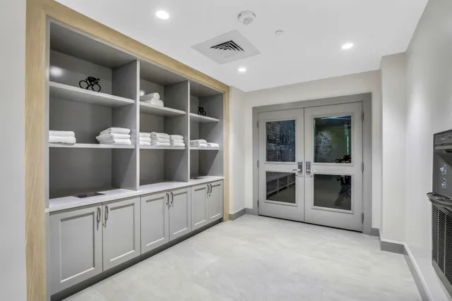 an aerial view of a house with a garden and lake view