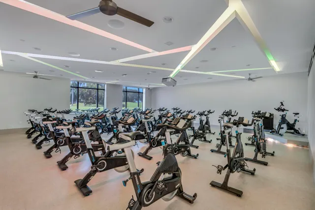 an aerial view of residential houses with outdoor space and river