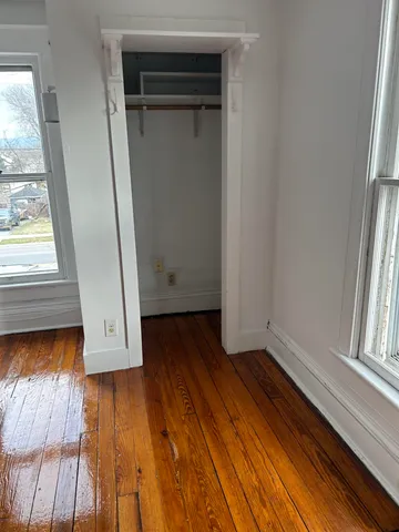 a view of front door with wooden floor