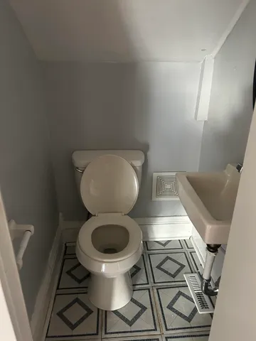 a bathroom with a toilet and a sink