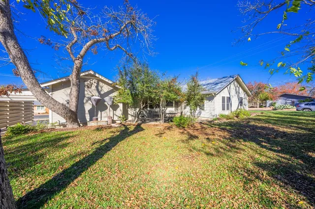 a view of a house with a big yard