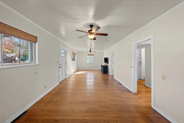 a view of an entryway with a chandelier fan