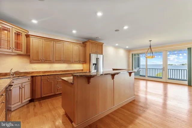 a kitchen with a stove a sink and a refrigerator