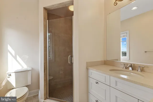 a view of a room with wooden floor and a window