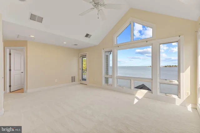 a spacious bathroom with a granite countertop tub sink and mirror