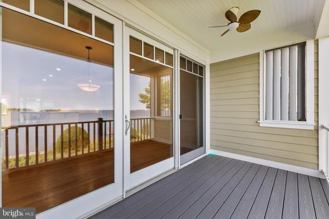 a roof deck with a table and chairs