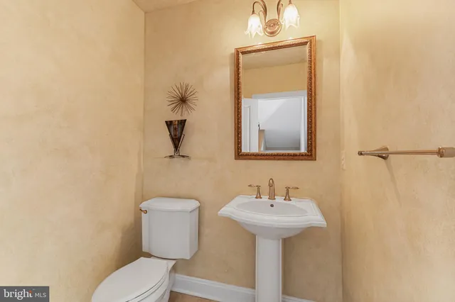 a view of a room with wooden floor and windows
