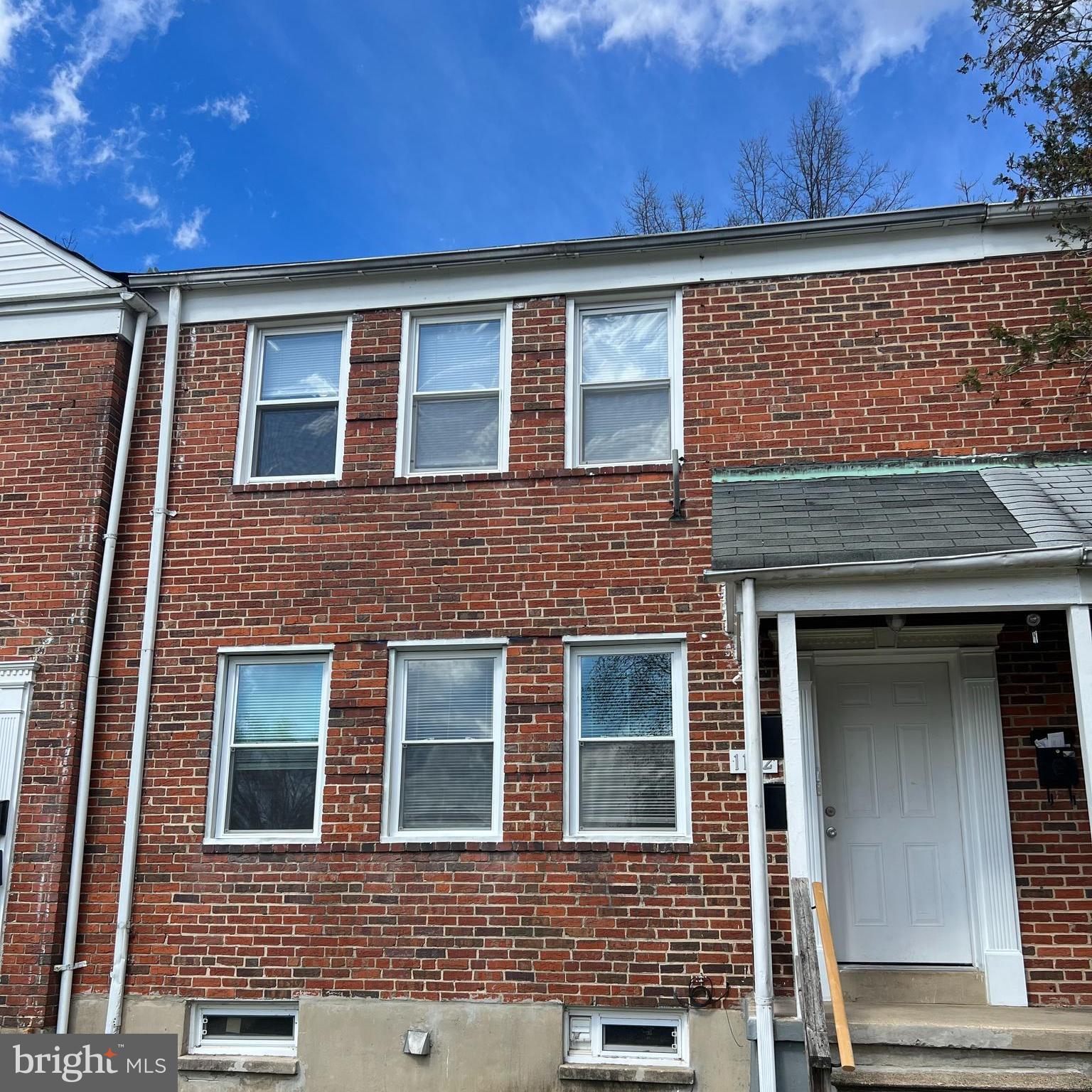 1102 Gleneagle Road Baltimore, MD 21239 - Photo 18 of 19 a front view of a building with a brick wall