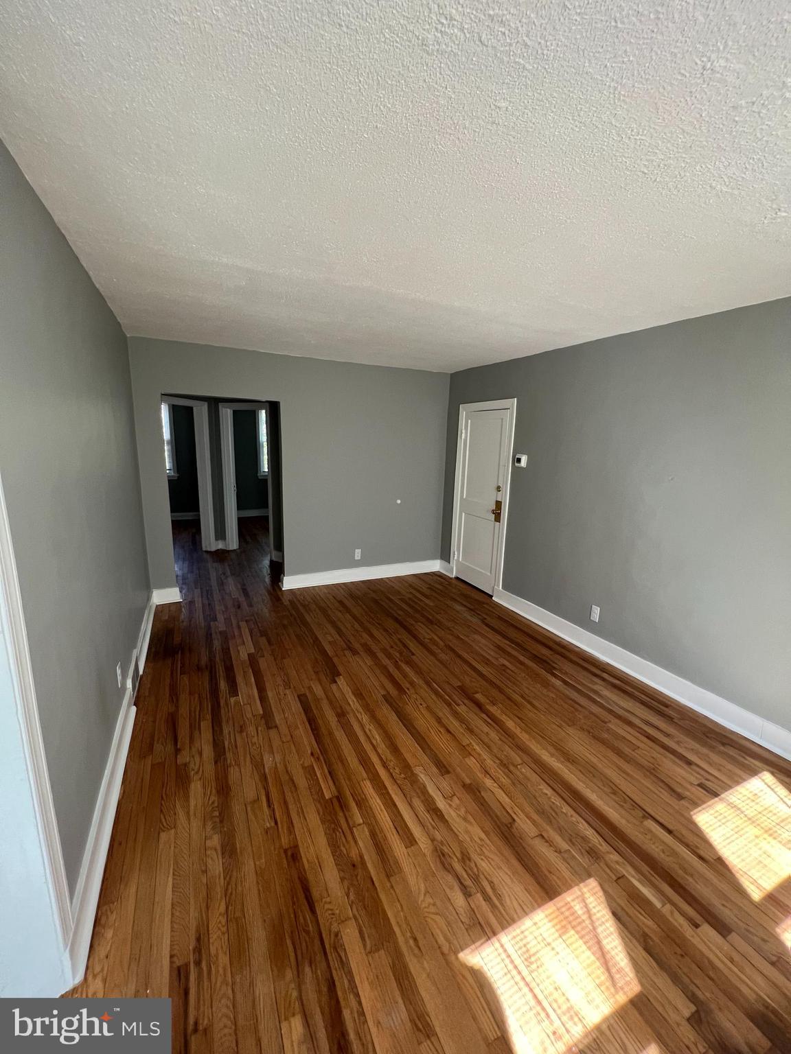 1102 Gleneagle Road Baltimore, MD 21239 - Photo 10 of 19 a view of a room with wooden floor