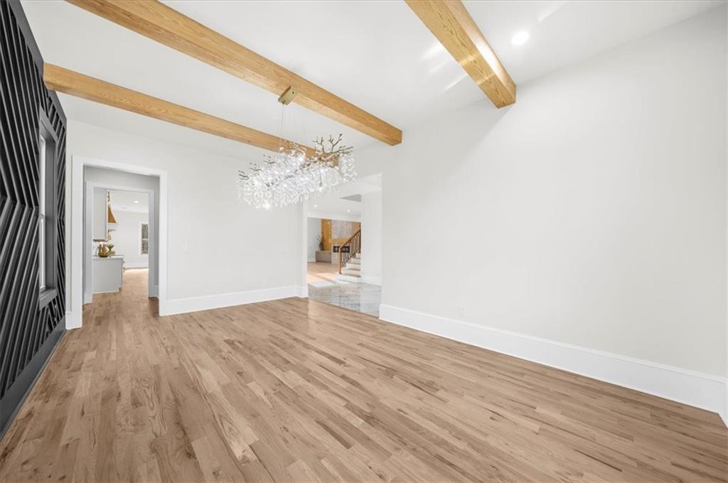 4543 Fawn Path Gainesville, GA 30506 - Photo 13 of 96 a view of a livingroom with wooden floor and a ceiling fan