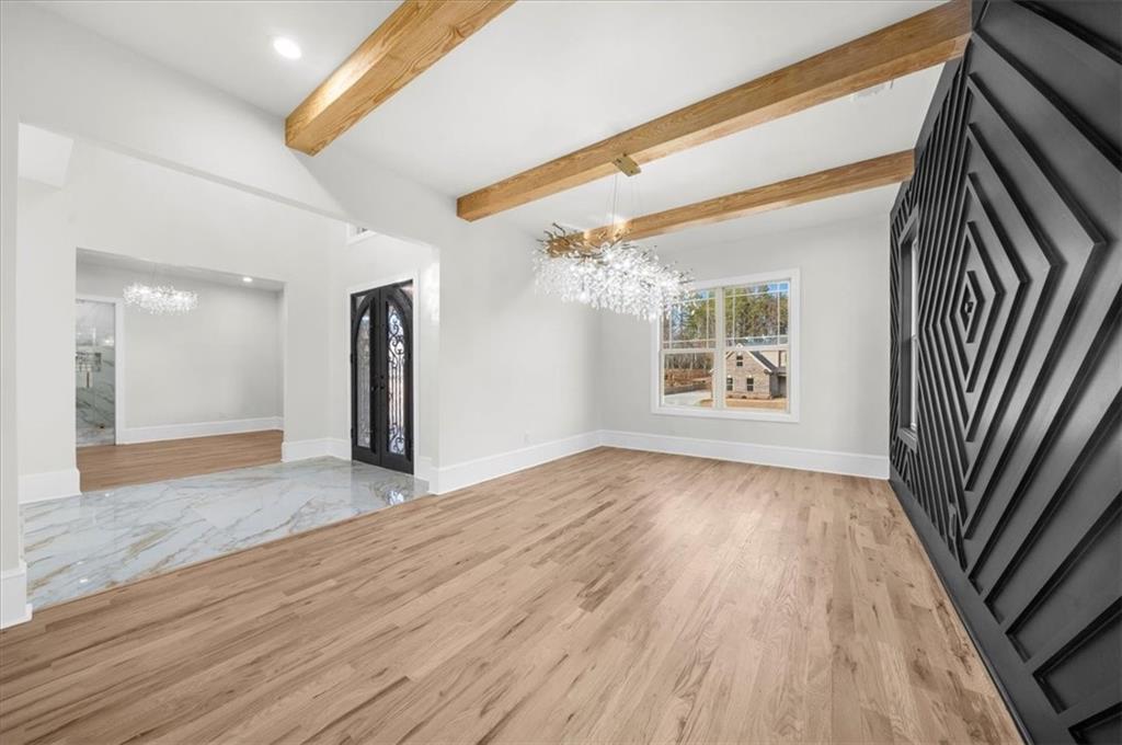 4543 Fawn Path Gainesville, GA 30506 - Photo 14 of 96 wooden floor in an empty room with a window