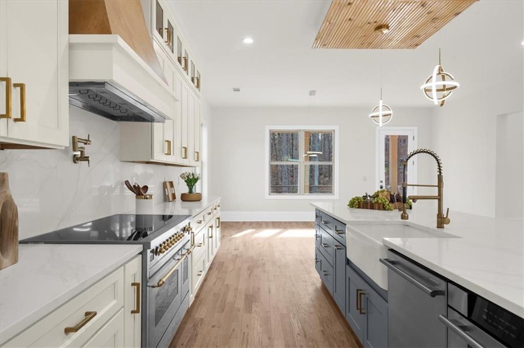 4543 Fawn Path Gainesville, GA 30506 - Photo 31 of 96 a kitchen with a sink stove and cabinets