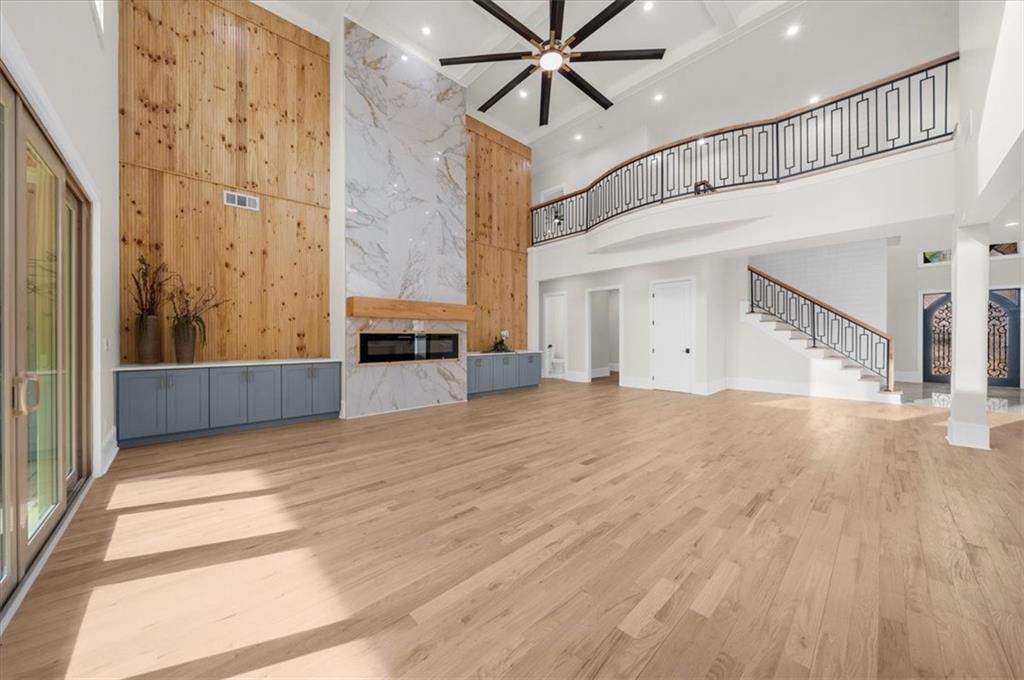 4543 Fawn Path Gainesville, GA 30506 - Photo 37 of 96 a view of a livingroom with wooden floor and a ceiling fan