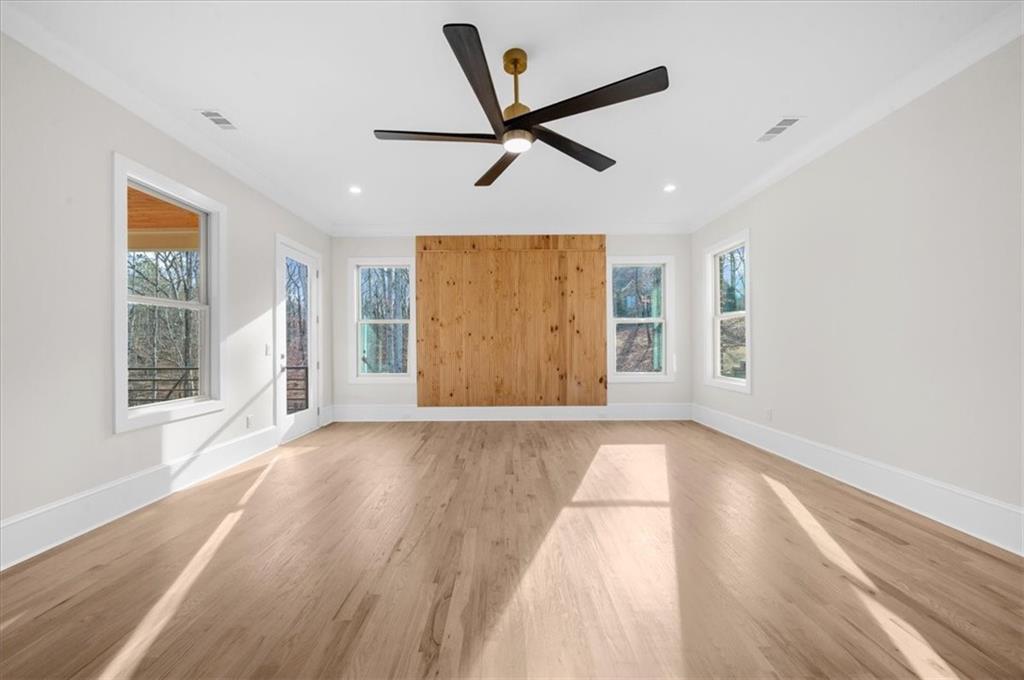 4543 Fawn Path Gainesville, GA 30506 - Photo 47 of 96 a view of an empty room with wooden floor and a window