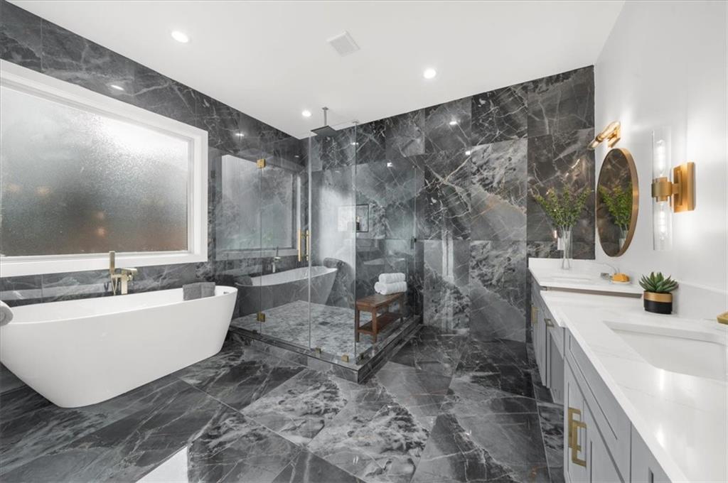 4543 Fawn Path Gainesville, GA 30506 - Photo 52 of 96 a bathroom with a bathtub sink mirror and toilet