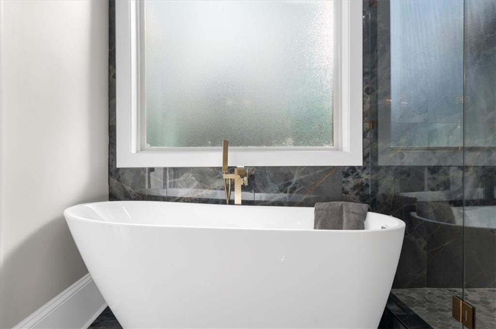 4543 Fawn Path Gainesville, GA 30506 - Photo 55 of 96 a white tub sitting in a bathroom