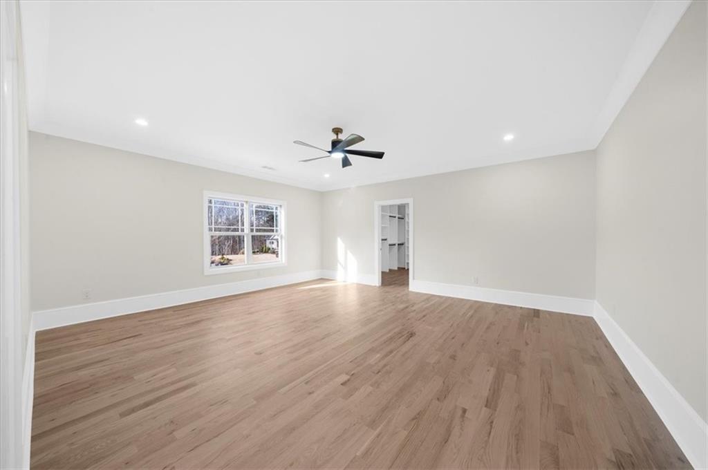 4543 Fawn Path Gainesville, GA 30506 - Photo 76 of 96 wooden floor in an empty room with a window