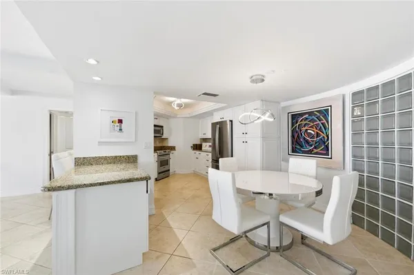 a living room with furniture and a granite counter tops