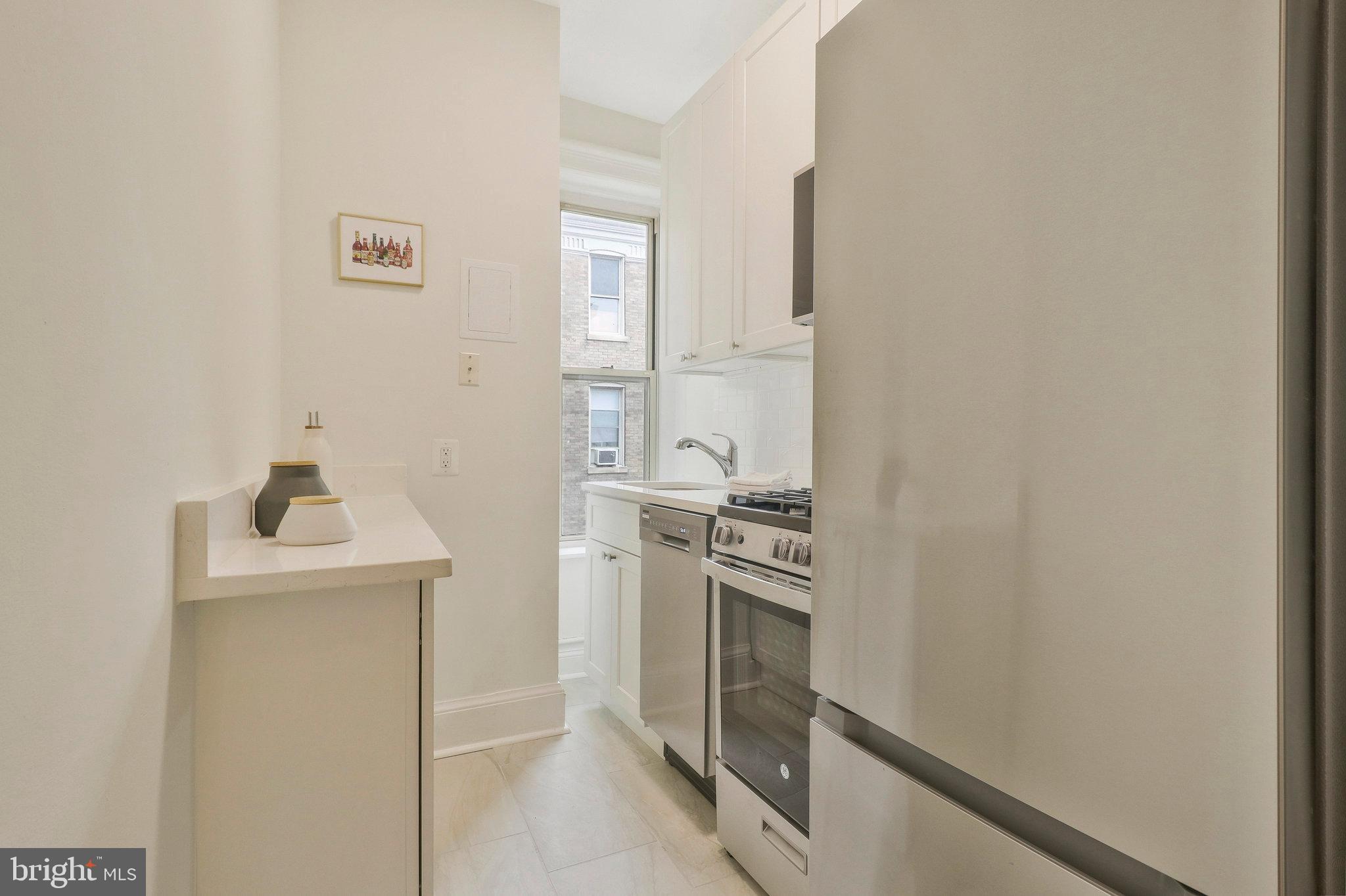 2022 Columbia Road Northwest, Unit 604 Washington, DC 20009 - Photo 11 of 19 Quartz countertop + SS appliances