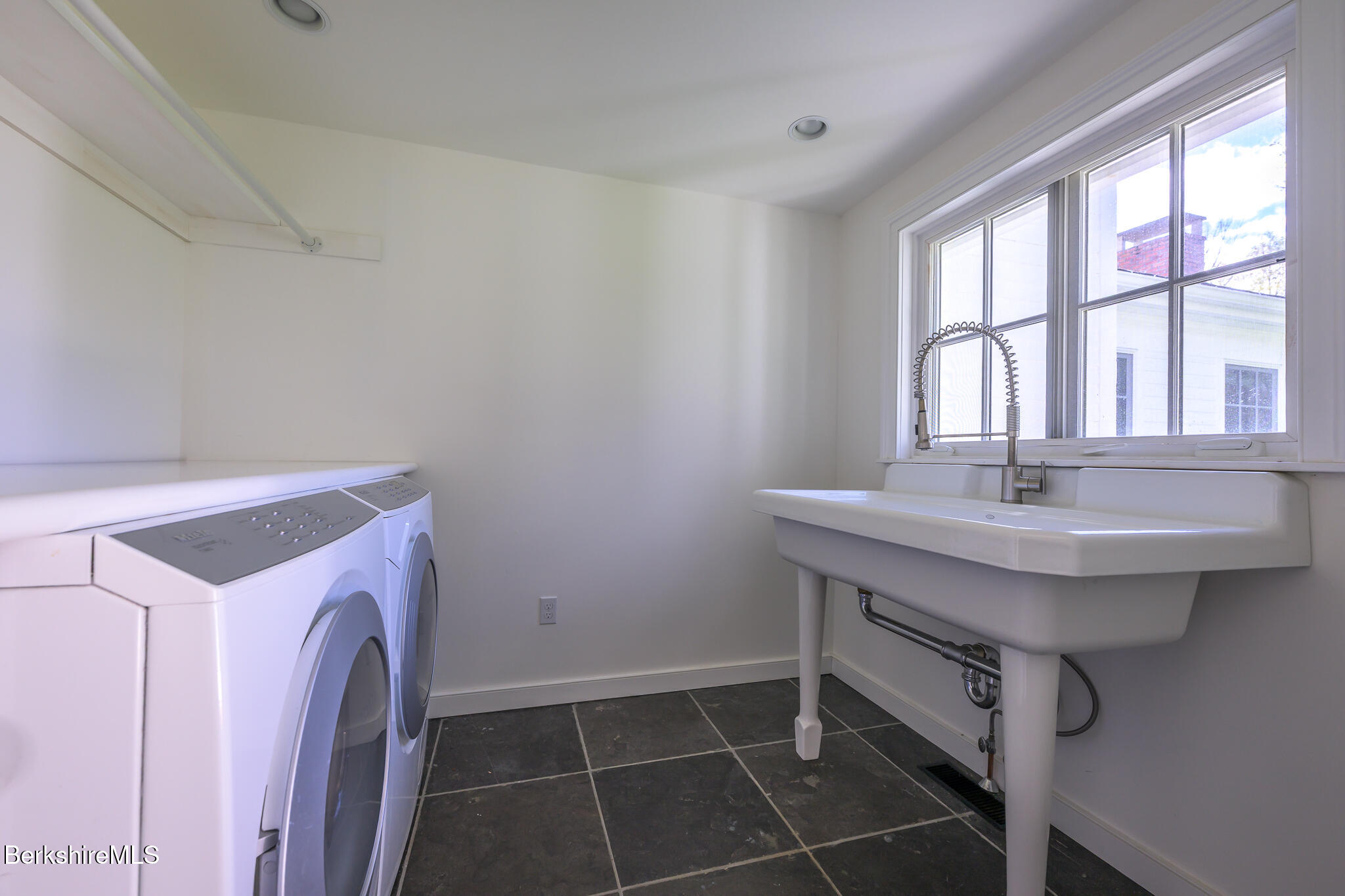 304 Hickey Hill Road Sheffield, MA 01257 - Photo 14 of 60 a sink and a table in a room