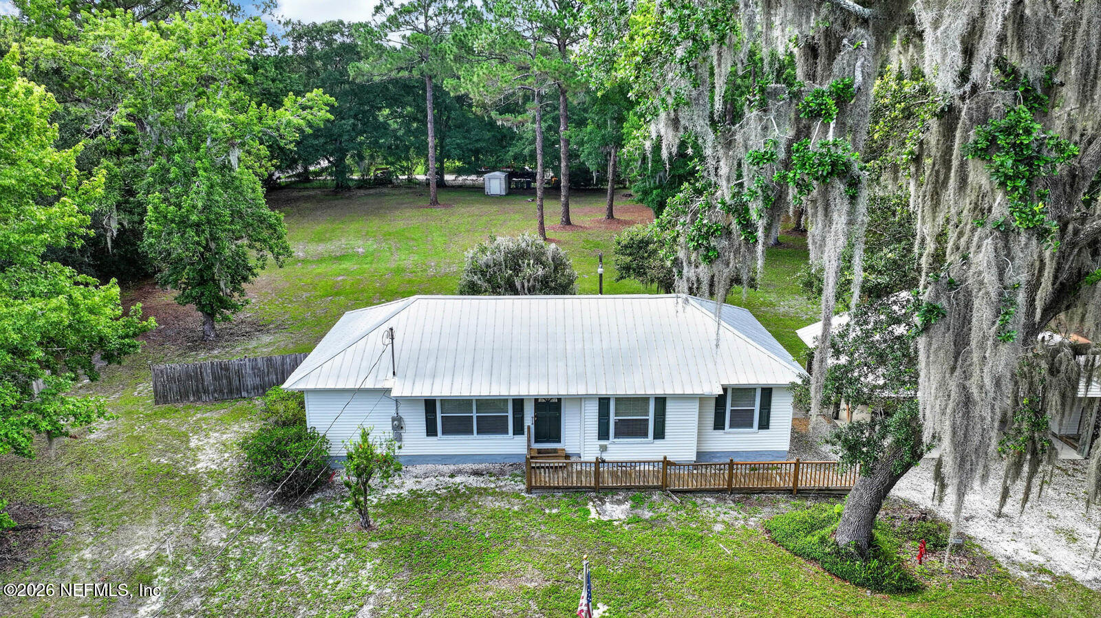 1950 Lightsey Road St. Augustine, FL 32084 - Photo 43 of 57 an aerial view of a house with a yard table and chairs